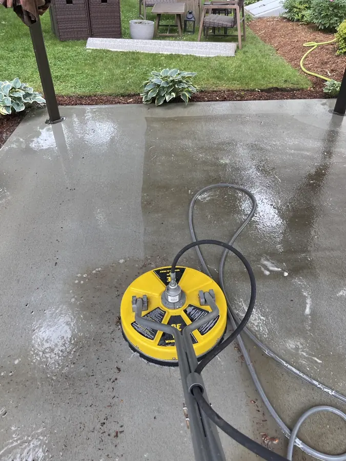 Concrete patio being surface cleaned